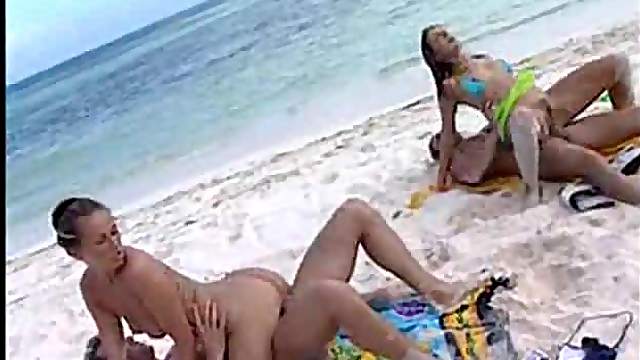 Two couples have sandy sex on the beach