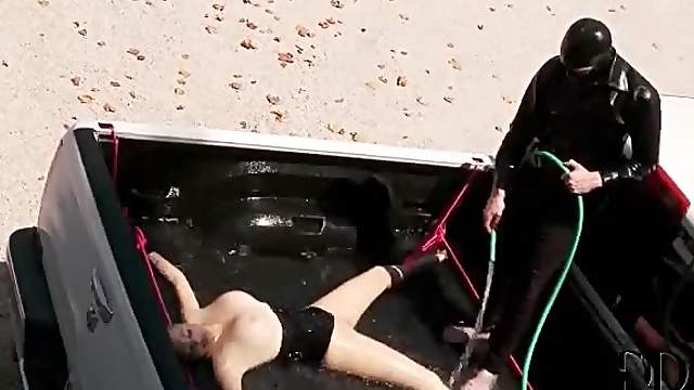 Daring babe in full body latex suit gets submerged in water