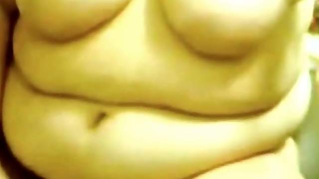 Close up on fat tummy as she masturbates