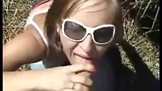 Outdoor blowjob from eager girl in gunglasses