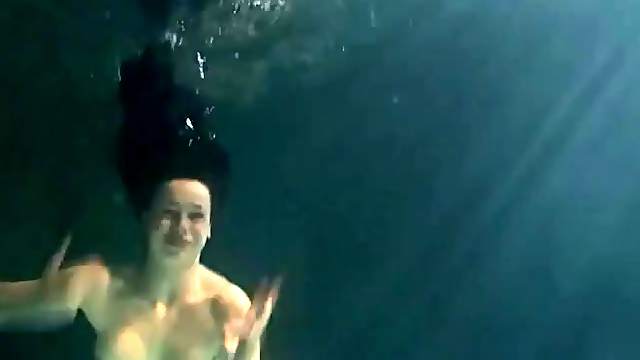 Shaved pussy brunette teen underwater