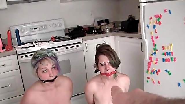 Kinky gagged girls in pissing porn video