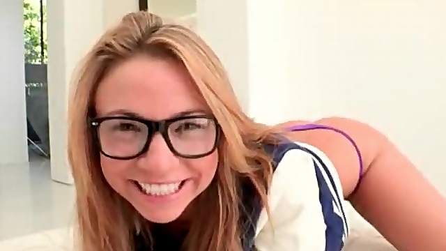 Cutie in glasses shakes her ass and fingers