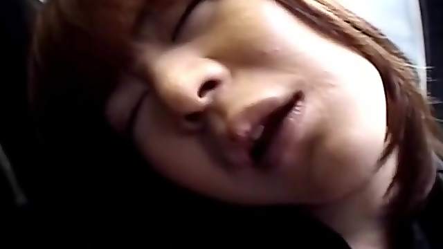 Japanese girl on a train flashes her cute tits