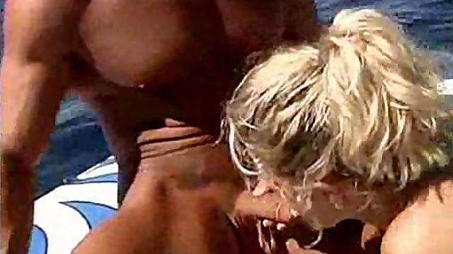 Sexy blonde on a boat loves eating dick