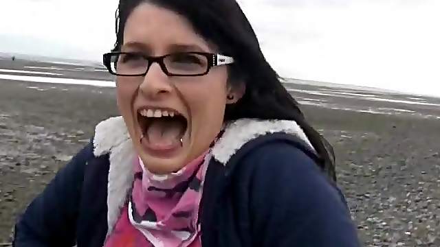 Cutie on the beach flashes her sexy tits
