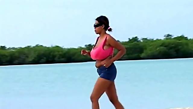 Huge boobs chick jogs on the beach
