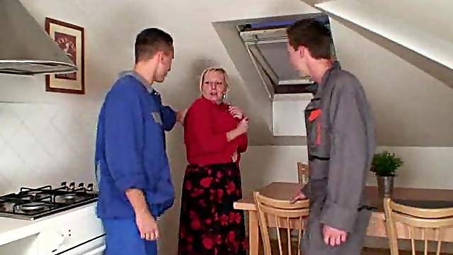 Busty granny lets handymen have her